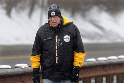 Regan Nerone, of South Park, takes his daily walk along Corrigan Drive in South Park as the afternoon snow comes down.