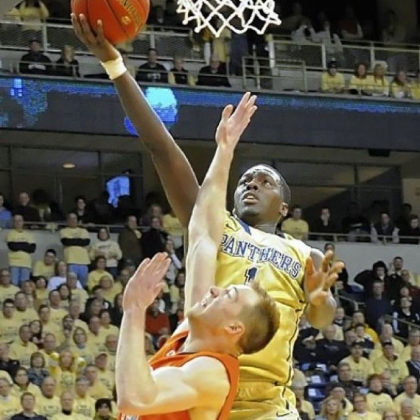 Pitt''s Tray Woodall drives to the net against Syracuse's Trevor Cooney in the second half Saturday at Petersen Events Center.