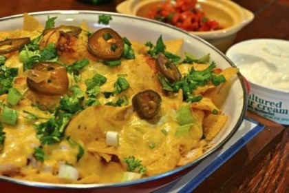 Emeril Lagasse's Shredded Chicken Nachos with Pico de Gallo.