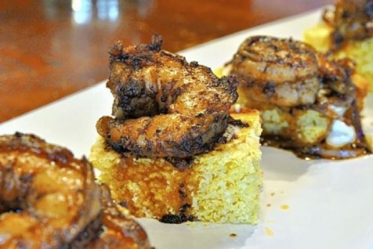 Spicy Garlic Shrimp, served on cornbread.