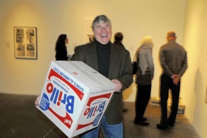 Frank Garger with a Brillo box that he bought by artist by Charles Lutz.