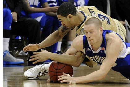 Pitt's Cameron Wright dives for the ball against Seton Hall's Kyle Smyth in the second half at Petersen Events Center.