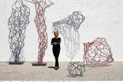Barbara Sorensen with her wiry aluminum "Dwellings V" installation of 2010. This sculpture is not in the Manchester exhibition but she will talk about it Thursday.