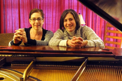 Pianists Tina Faigen and Becky Billock at a practice session.