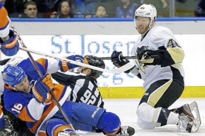 New York's Marty Reasoner and linesman Mark Shewchyk go down in a heap as Joe Vitale looks on in the third period of Tuesday's 4-2 win against John Tavares and the Islanders.