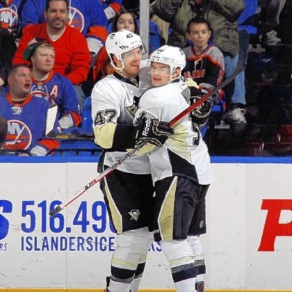 Simon Despres, left, celebrates a second-period goal with Chris Kunitz in the Penguins' victory last night in New York.