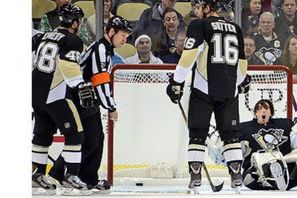 Penguins goalie Marc-Andre Fleury protests a penalty not being called after having his mask knocked off as the Capitals scored 1-0 in the first period.