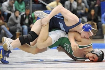 Burrell's Corey Falleroni drives South Fayette's Jack Previte into the mat during the 160-pound bout of the WPIAL Class AA team wrestling championship match.