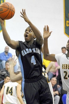 Washington's Dupree Jenkins drives to the hoop against Seton-LaSalle's Levi Masua last Friday.