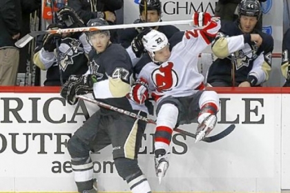 Simon Despres takes New Jersey's David Clarkson into the bench area in the Penguins win against the Devils Saturday at Consol Energy Center. Despres has a plus-minus rating of plus-4 in eight games.