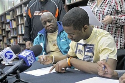 Terrish Webb, a member of the Clairton High School football team, signs his letter of intent to play for the University of Pittsburgh.