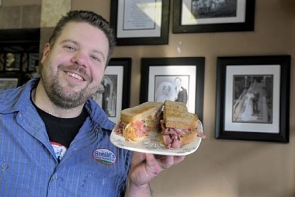 Hoya (grilled corned beef) at Szmidt's Old World Deli in Greenfield, held by owner Darren Smith.