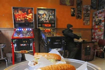 Seitan Pittsburgh "Steak" foreground and the Seitan Buffalo Melt at Spak Bros. in Garfield