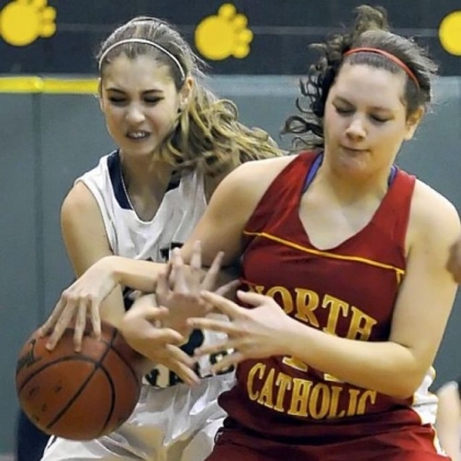 Vincentian Academy's Kiersten Elliott and North Catholic's Abby Goetz fight for the ball Thursday night at Marshall Middle School. Vincentian won, 50-33.