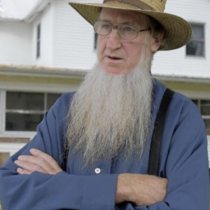 Sam Mullet stands in the front yard of his home in Bergholz, Ohio.