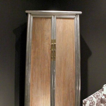 Brownstone's silver leaf and reclaimed elm wood Regency Cabinet with silver leaf trim.