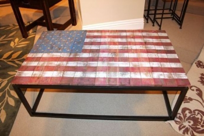 Magnussen Home's American cocktail table done in reclaimed solid wood and an old world paint finish on a rustic brown metal base.