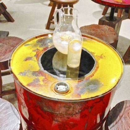 Reclaimed steel drum side table with glass top  by Groovystuff.