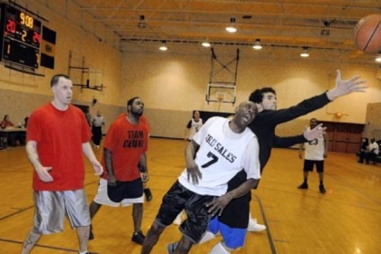 No. 7 Frankie J. of the Light of Life Rescue Mission team loses a rebound to a player from the Allegheny County Treatment Alternative Program team.