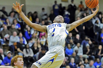 West Mifflin's Cye Murphy reaches for a rebound against Thomas Jefferson Friday night.