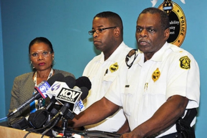 Commander Eric Holmes, left, and Chief Nate Harper at a news conference in September.