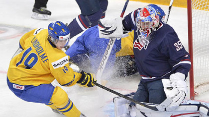 Team USA goaltender John Gibson makes a save off Sweden's Elias Lindholm during first period gold medal hockey action at the IIHF World Junior Championships in Ufa, Russia today.