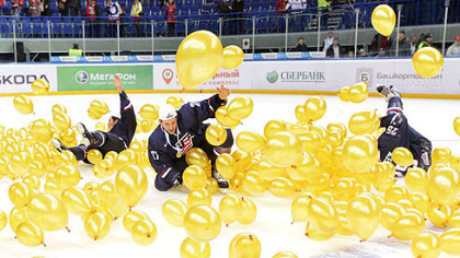 Team USA celebrates in balloons on the ice after defeating Sweden for the gold medal at the IIHF World Junior Championships in Ufa, Russia, today.