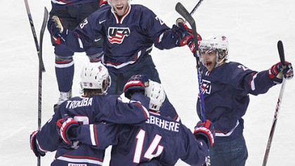 Team USA's Rocco Grimaldi, top celebrates his second goal against Sweden with teammates, from left, Jacob Trouba, Shayne Gostisbehere and Vince Trocheck during second period gold medal hockey action at the IIHF World Junior Championships in Ufa, Russia,today.