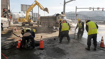 Work crews Thursday afternoon at the intersection of Wood Street and Fort Pitt Boulevard.