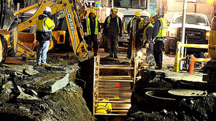 Work continues early Friday morning at scene of yesterday's major water main break at the intersection of Fort Pitt Boulevard and Wood Street.