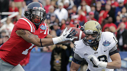 Mississippi receiver Randall Mackey catches a touchdown pass as Pitt Jarred Holley defends during the first quarter of today's BBVA Compass Bowl in Birmingham.