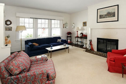 The living room's fireplace is gas burning.
