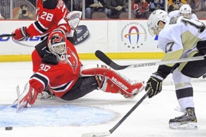 Martin Brodeur reaches back to make one of his 24 saves.