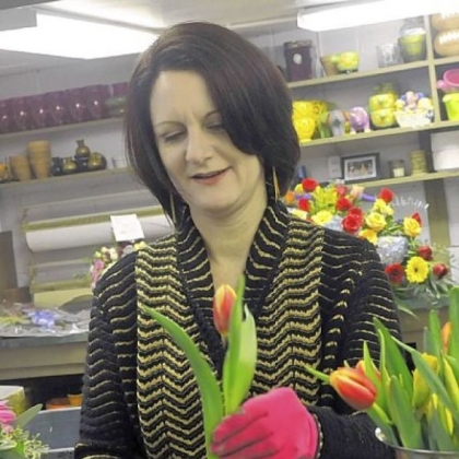 Carmel Vandale assembles arrangements in her floral shop in Mt. Lebanon.