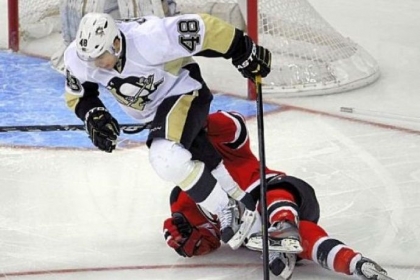 Tyler Kennedy clears a fallen Stephen Gionta in the Penguins' 3-1 loss to New Jersey Saturday.
