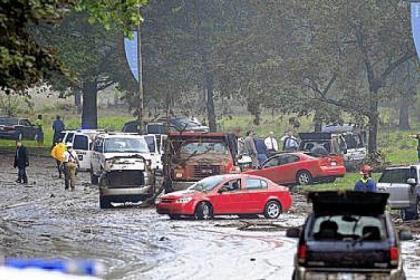 Aug. 19, 2011: Cars strewn on Washington Boulevard after storms brought heavy rains and street flooding. Four people died.