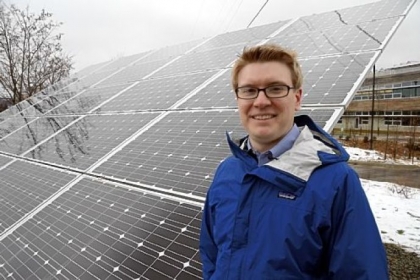 Jason Wirick, director of facilities and sustainability management at Phipps Conservatory and Botanical Gardens, poses in front of one of the solar panels for the new Center for Sustainable Landscapes.