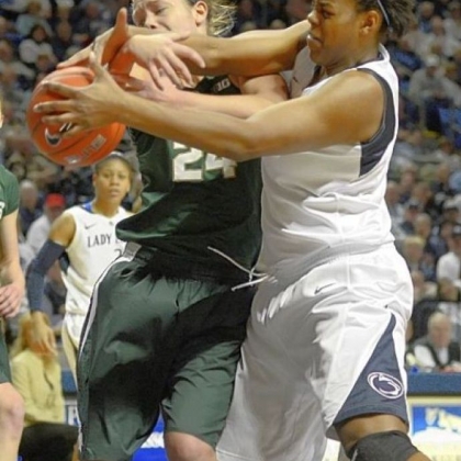 Penn State's Talia East, right, reaches past Michigan State's Courtney Schiffauer for a rebound in the first half Sunday in University Park, Pa.