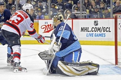 The Devils' David Clarkson moves past Penguins defenseman Brooks Orpik to score against Penguins goaltender Tomas Vokoun in the second period Sunday night at Consol Energy Center.