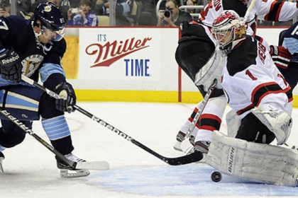 Devils goaltender Johan Hedberg stops a shot by the Penguins' Sidney Crosby in the first period at Consol Energy Center.