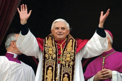 Pope Benedict XVI greeting the crowd from the central balcony of St. Peter's Basilica moments after being elected in 2005.