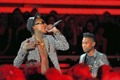 Musicians Wiz Khalifa, left, and Miguel perform at the 55th annual Grammy Awards.