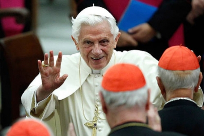 Pope Benedict XVI waving as he leaves Paul VI hall after attending a concert in November, 2011.