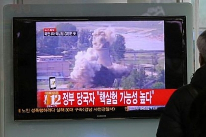 A South Korean man watches TV news showing file footage of the demolition of the cooling tower of the Yongbyon nuclear complex, following a report of a possible nuclear test conducted by North Korea, Tuesday at the Seoul train station in Seoul, South Korea.