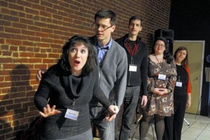 Abby Fudor, left, and Randy Kirk of Arcade Comedy Theater do an improv sketch during the Cultural District Gallery Crawl at the end of last month. At rear are Mark Bailey, Liz Labacz, and Kristy Nolen.