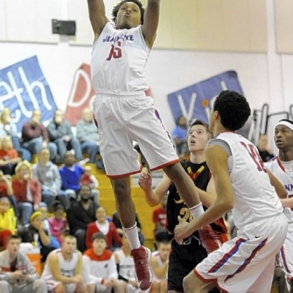 Jeannette junior forward Damone Morton pulls down a rebound against Serra Catholic.