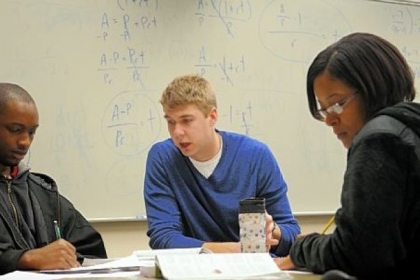 CCAC students Jordan Mackey, left, and Devon Morgan work with Erik Carlberg, math facilitator for the Math Cafe at the Boyce campus.