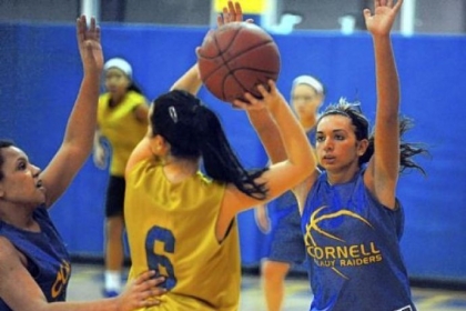 Mason DePetro, right, has scored 1,145 points, the most by a female player for Cornell High School. Practicing with her are teammates Anna Yaworski, left, and Miranda Dorste, center.
