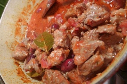 Braised Iberico Pork with Tomatoes, Chorizo, Thyme and Black Olives from "Spanish Flavors" by Jose Pizarro.