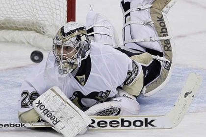 Marc-Andre Fleury makes one of his 25 saves against the Jets Friday in Winnipeg, Manitoba.
